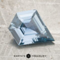 A 2.36-carat blue sapphire with a step-cut design is displayed on a textured surface, featuring the "Earth's Treasury" logo and text at the bottom.