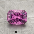 A rectangular, faceted 2.01-carat pastel pyrope garnet with visible inclusions sits on a gray patterned background, with "EARTH'S TREASURY" beneath it.