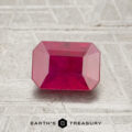 A faceted 1.16-carat rectangular ruby is displayed on a textured surface with "Earth's Treasury" written below.