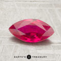 A 1.22-carat marquise-cut deep pink ruby is displayed on a textured surface with the words "Earth's Treasury" beneath it.