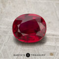 A 2.04-carat Mozambique ruby (heated), expertly cut in an oval shape, is displayed on a textured gray surface, with the "Earth's Treasury" logo and text at the bottom of the image.
