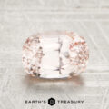 A faceted, oval-cut pale pink 2.24-Carat Ceylon Sapphire is displayed on a light textured surface with the Earth’s Treasury logo below.