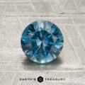 A 1.49-carat teal blue to violet color-change Montana sapphire with faceted cuts displayed on a textured light background, featuring the "Earth's Treasury" logo and text at the bottom.